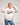 Courtney Miller in a White Smosh Brutal crewneck sweater