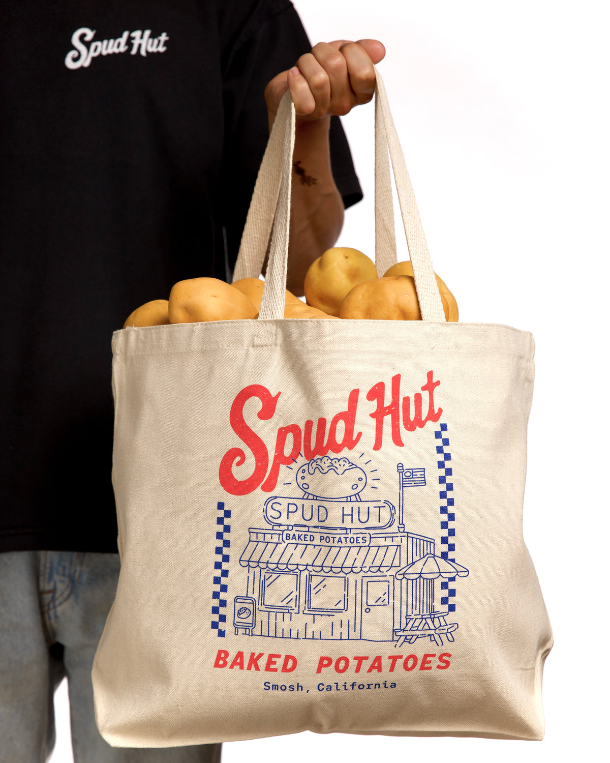 Spud Hut tote bag with potatoes on a white background