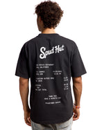 man wearing tshirt with receipt printed on the back