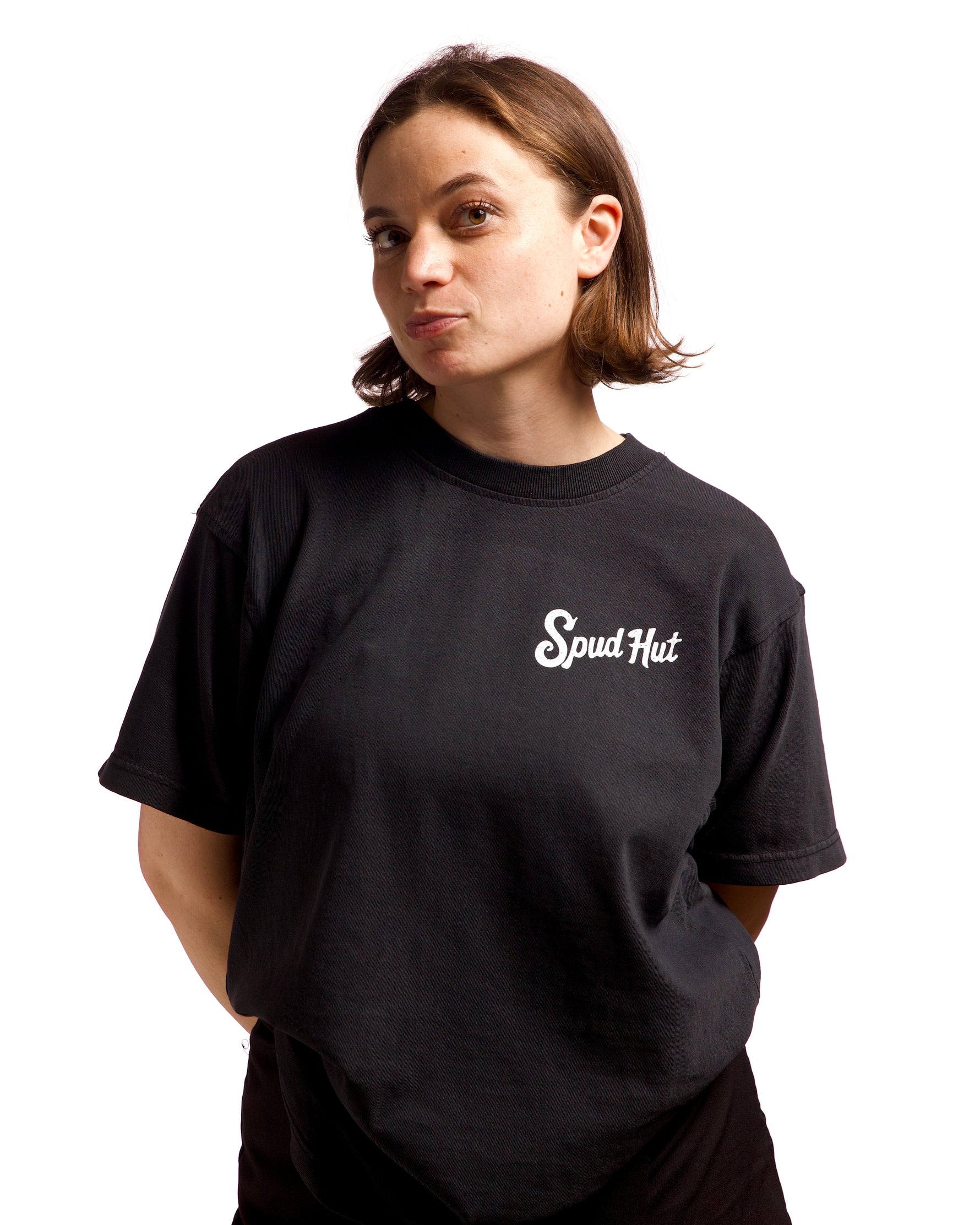 woman wearing black tshirt with sput hut written on the side of the chest