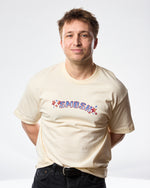 A person wearing a beige t-shirt with the word 'SMOSH' printed on the front.