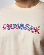 cream colored tshirt with smosh written on the front with stars around the letters