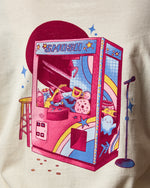 back of shirt has a claw machine 