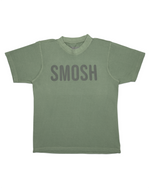 Green t-shirt with 'Smosh' text on a white background