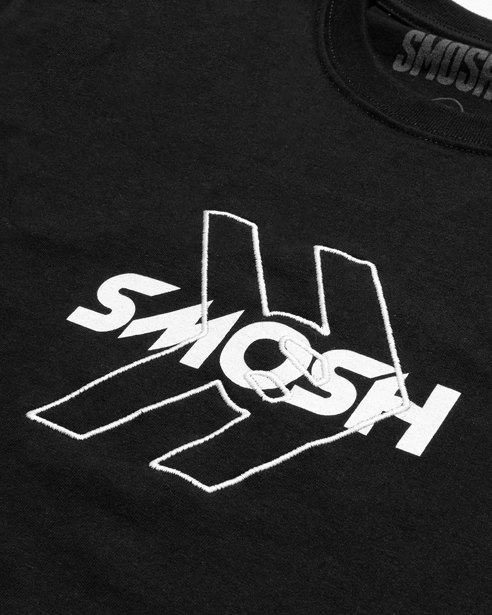 Black t-shirt with white 'SMOSH' logo on a dark background