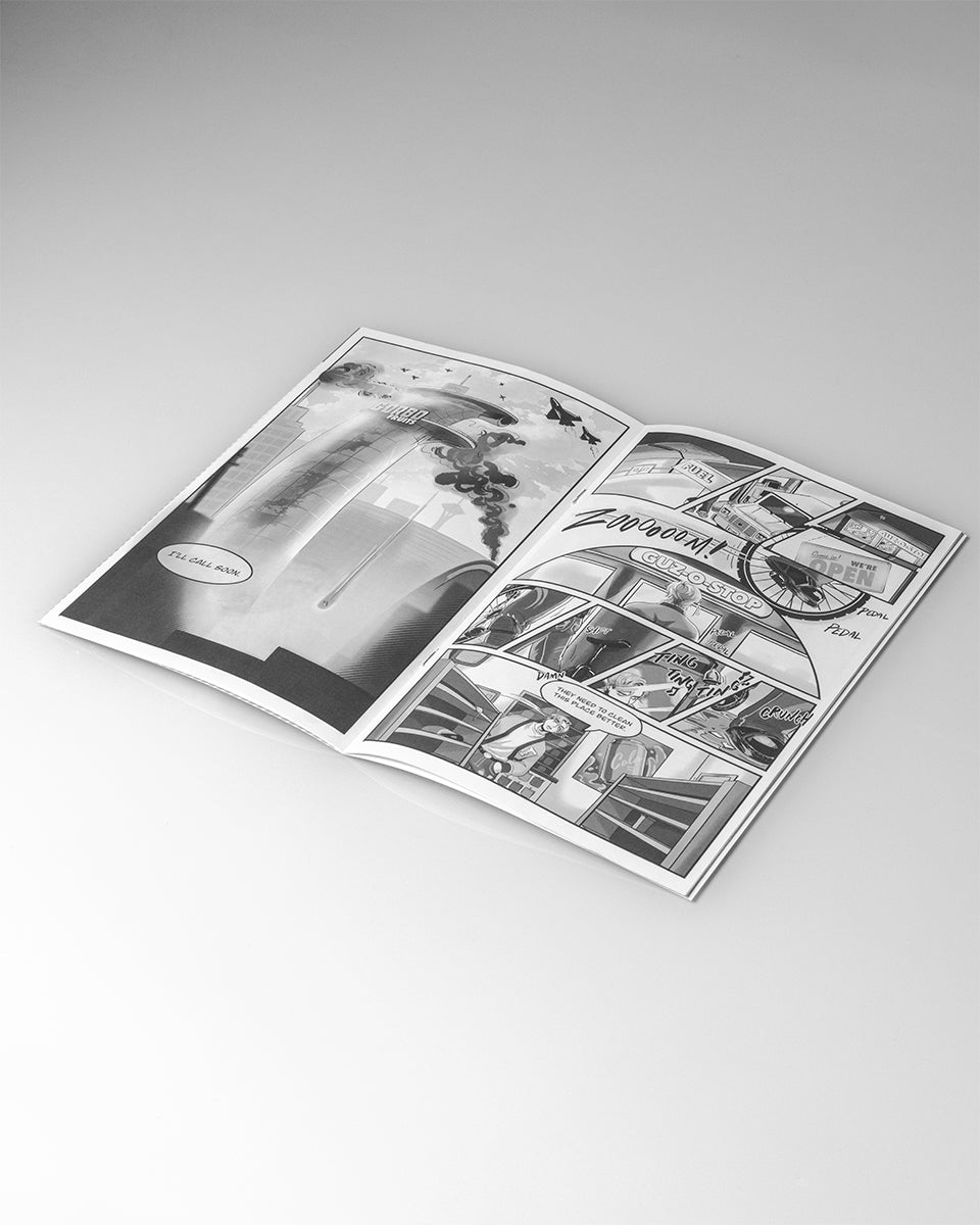 Open book with black and white illustrations on a gray background