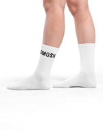 White socks with 'SMOSH' logo worn by a person on a white background
