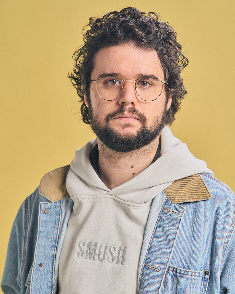 Spencer Agnew in grey Smosh essentials embroidered hoodie