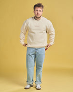 Shayne Topp wearing Cream Smosh Essentials Embroidered Crewneck