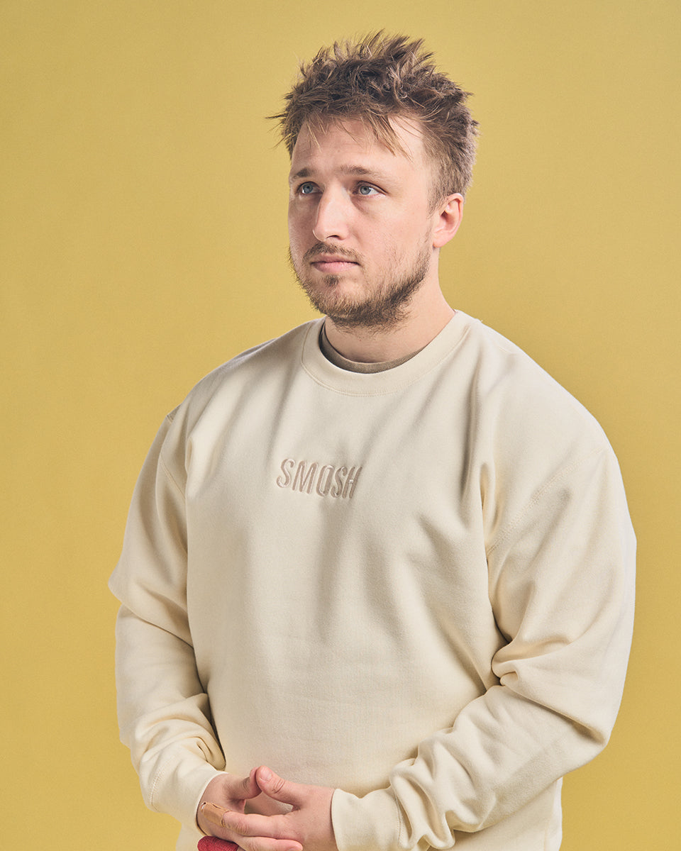Shayne Topp wearing Cream Smosh Essentials Embroidered Crewneck