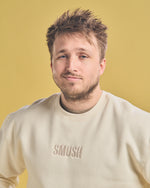 Shayne Topp wearing Cream Smosh Essentials Embroidered Crewneck