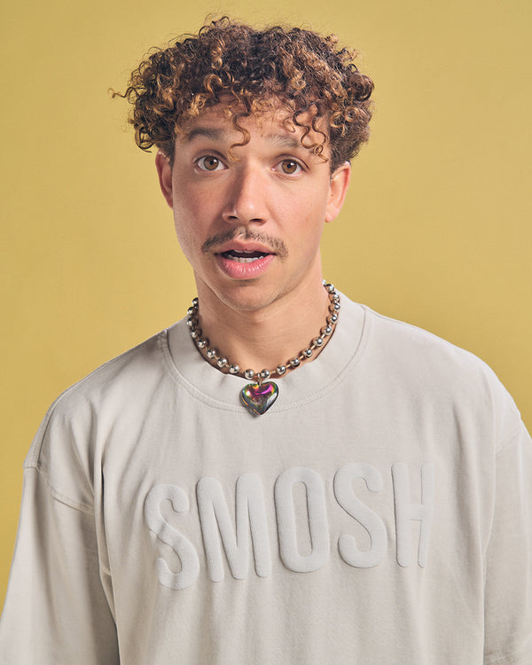 Chanse McCrary in a cream smosh puffy tee