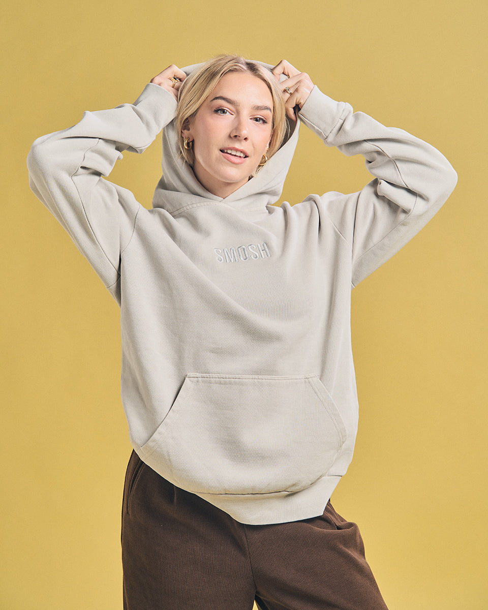 Courtney Miller in grey Smosh essentials embroidered hoodie