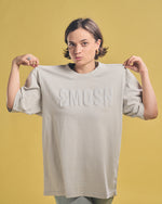 Angela Giarratana in a cream smosh puffy tee