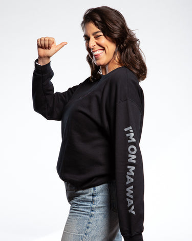 Amanda Lehan-Canto wearing SMOSH black long sleeve Gerald Cakes Crewneck