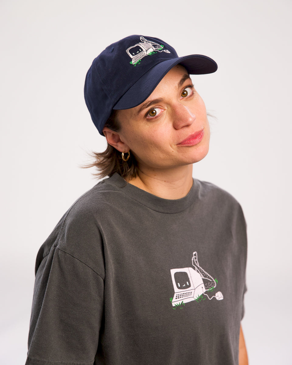 Angela Giarratana wearing smosh navy blue base ball cap with chronically offline logo
