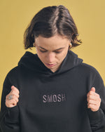 Angela Giarratana in black essentials embroidered hoodie