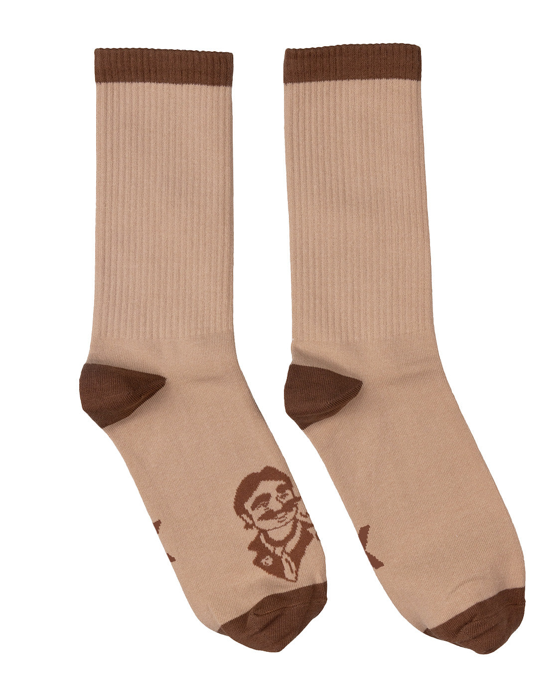 A pair of beige ribbed crew socks with dark brown heels, toes, and cuffs, featuring a brown graphic print of a man's face on the sole of one sock, displayed against a plain white background.