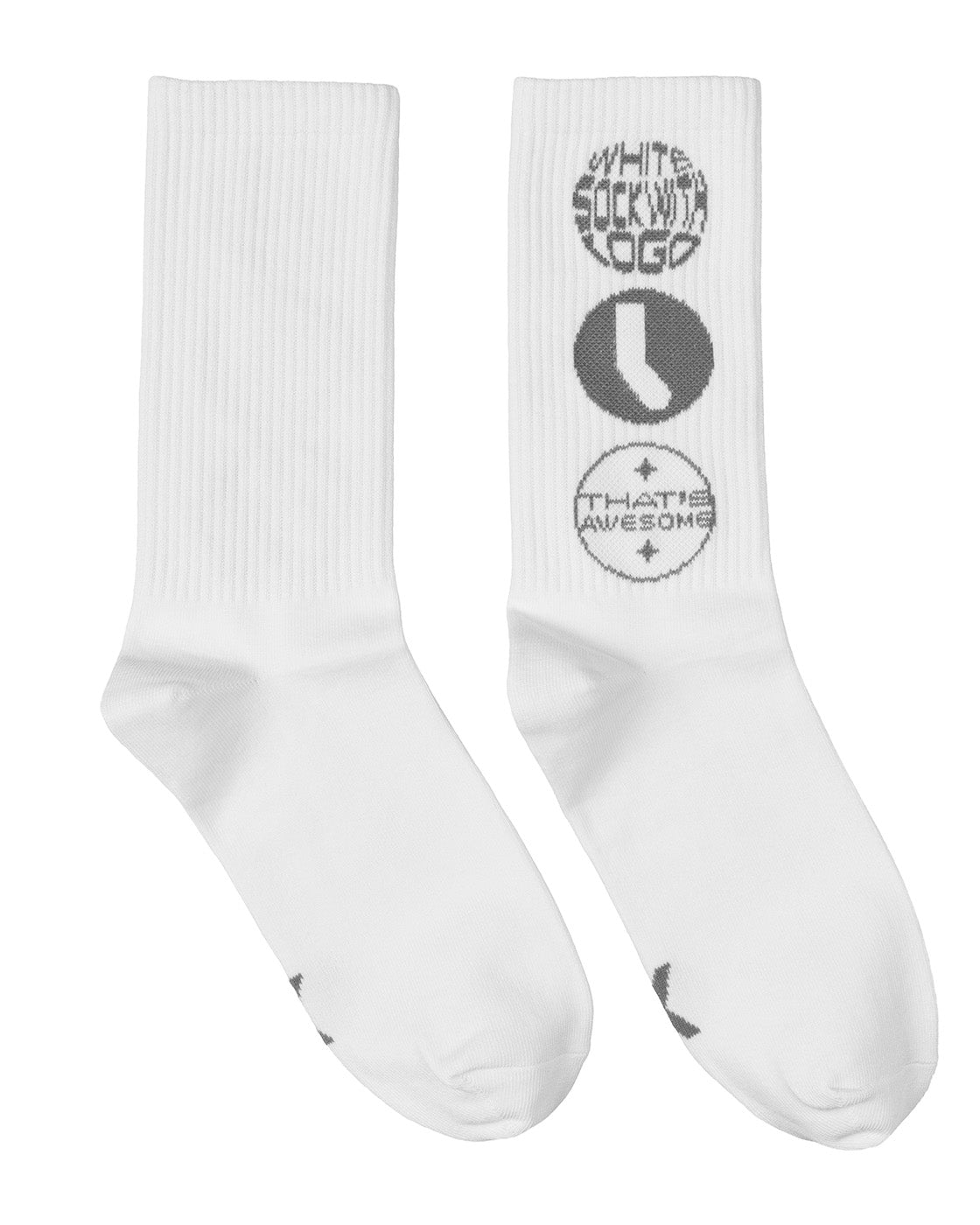 A pair of white crew socks with gray graphic prints. One sock features a vertical stack of circular logos reading 'WHITE SOCK WITH LOGO', 'L', and 'THAT'S AWESOME'.