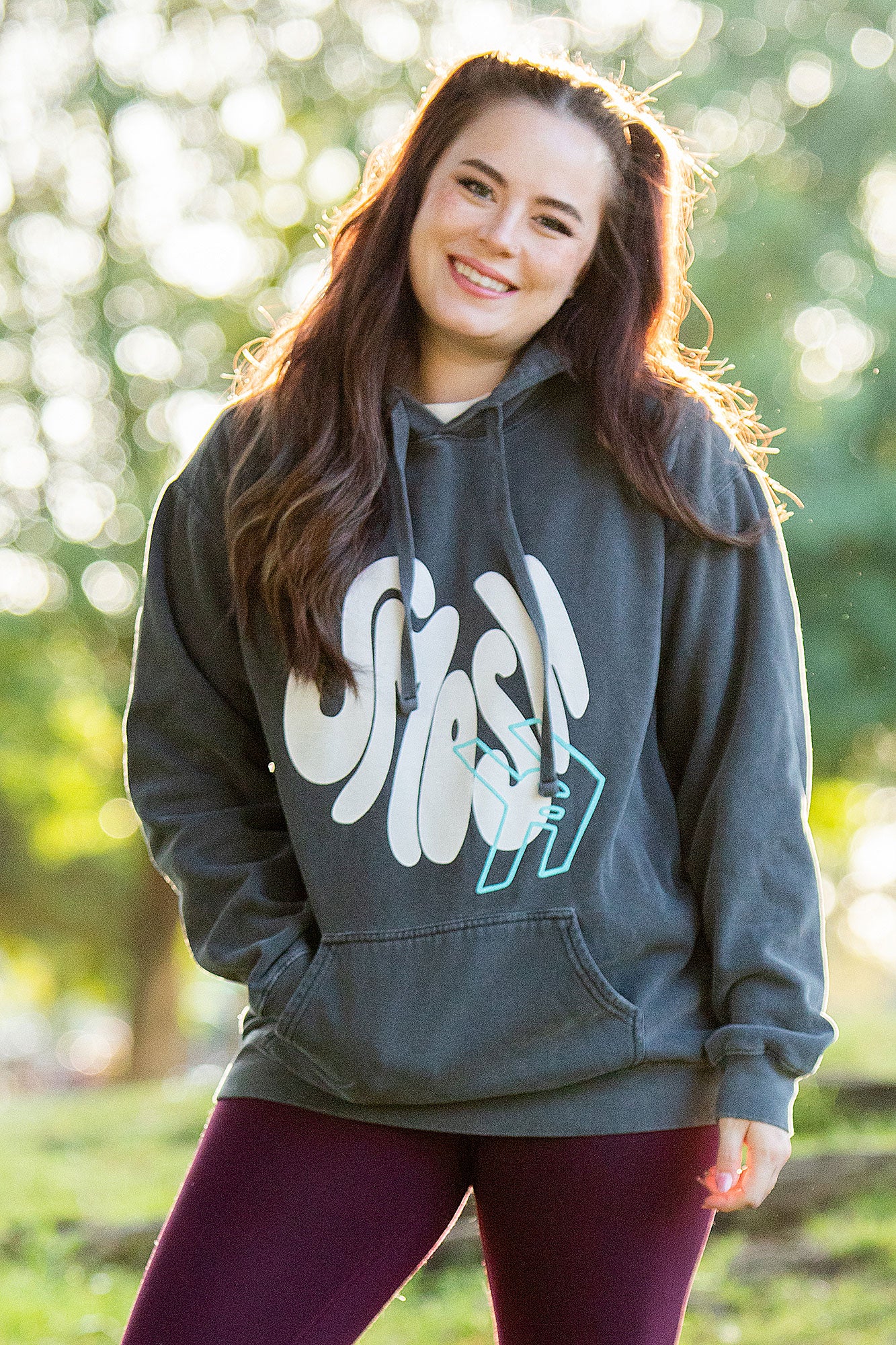 Sarah Whittle from Smosh wearing Smosh Groovy Hoodie with puff ink