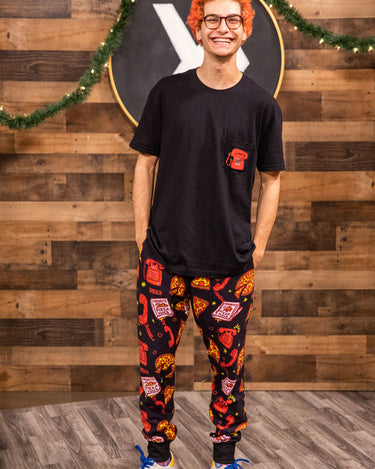 Noah from Smosh wearing holiday pizza place joggers